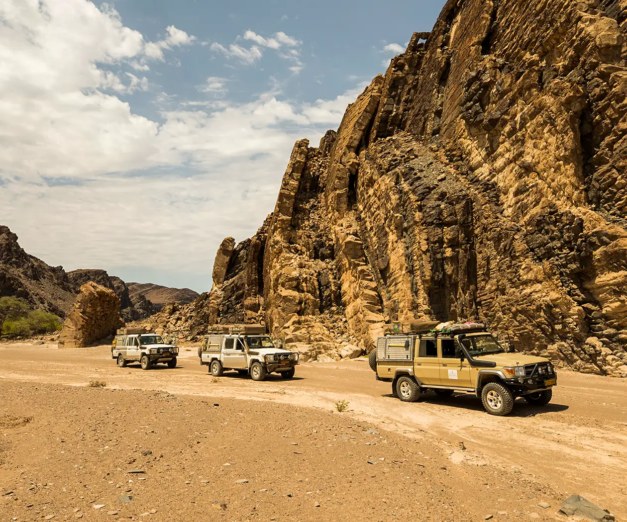 Three 4x4 rental Cars in Convoy behind leading vehicle with Guide Rainer