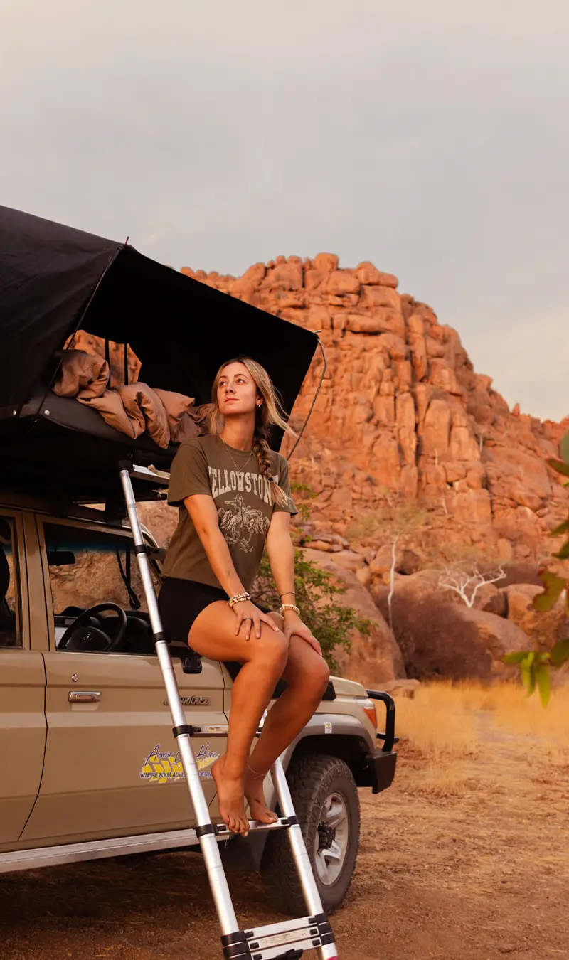 Girl on 4×4 Rental Car With Rooftoptents in Namibia